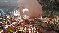 Boy goes for nude dip in the creek Thumb