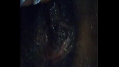 Rubbing her black pussy Thumb